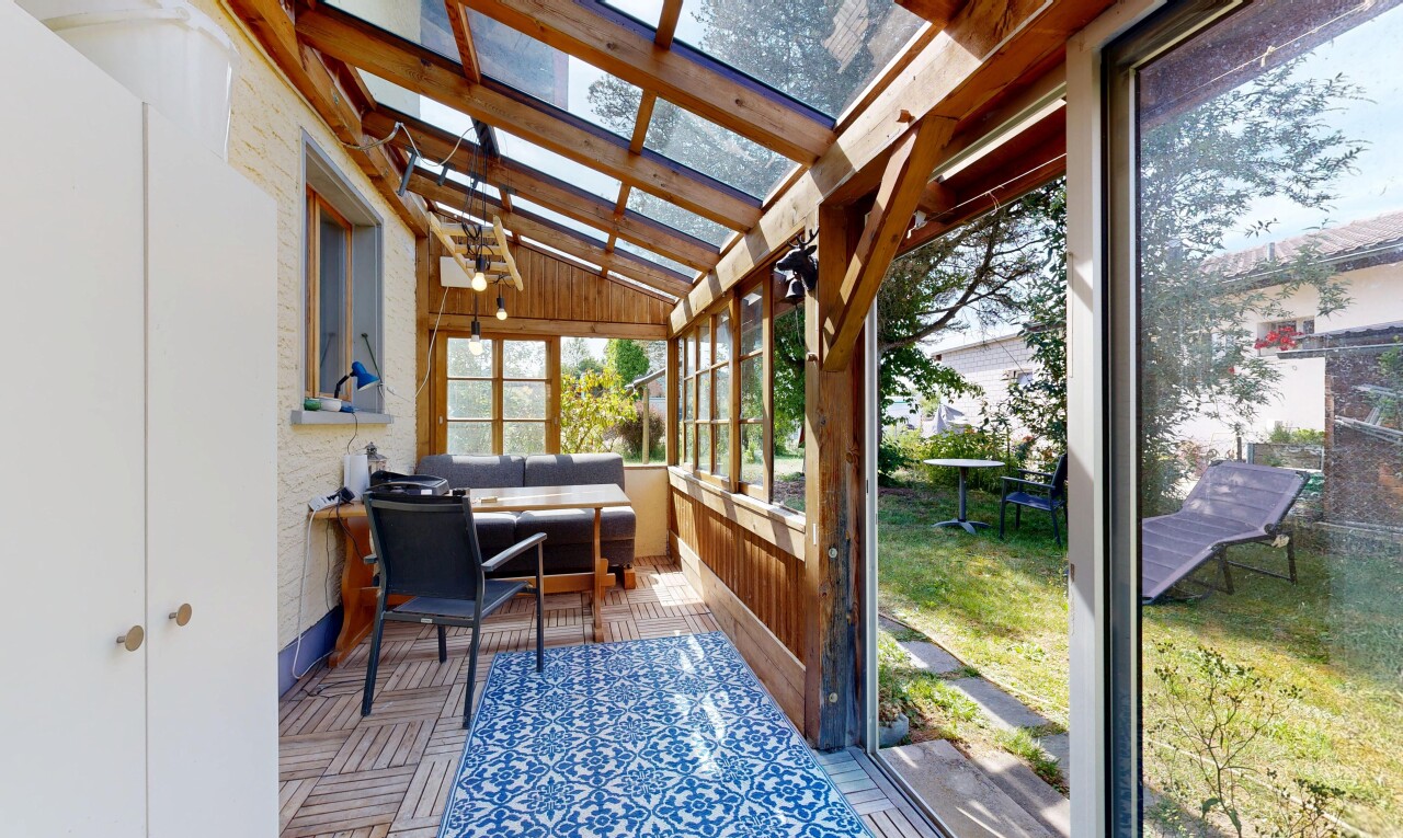 terrace featuring a sunroom and an outdoor lounge area