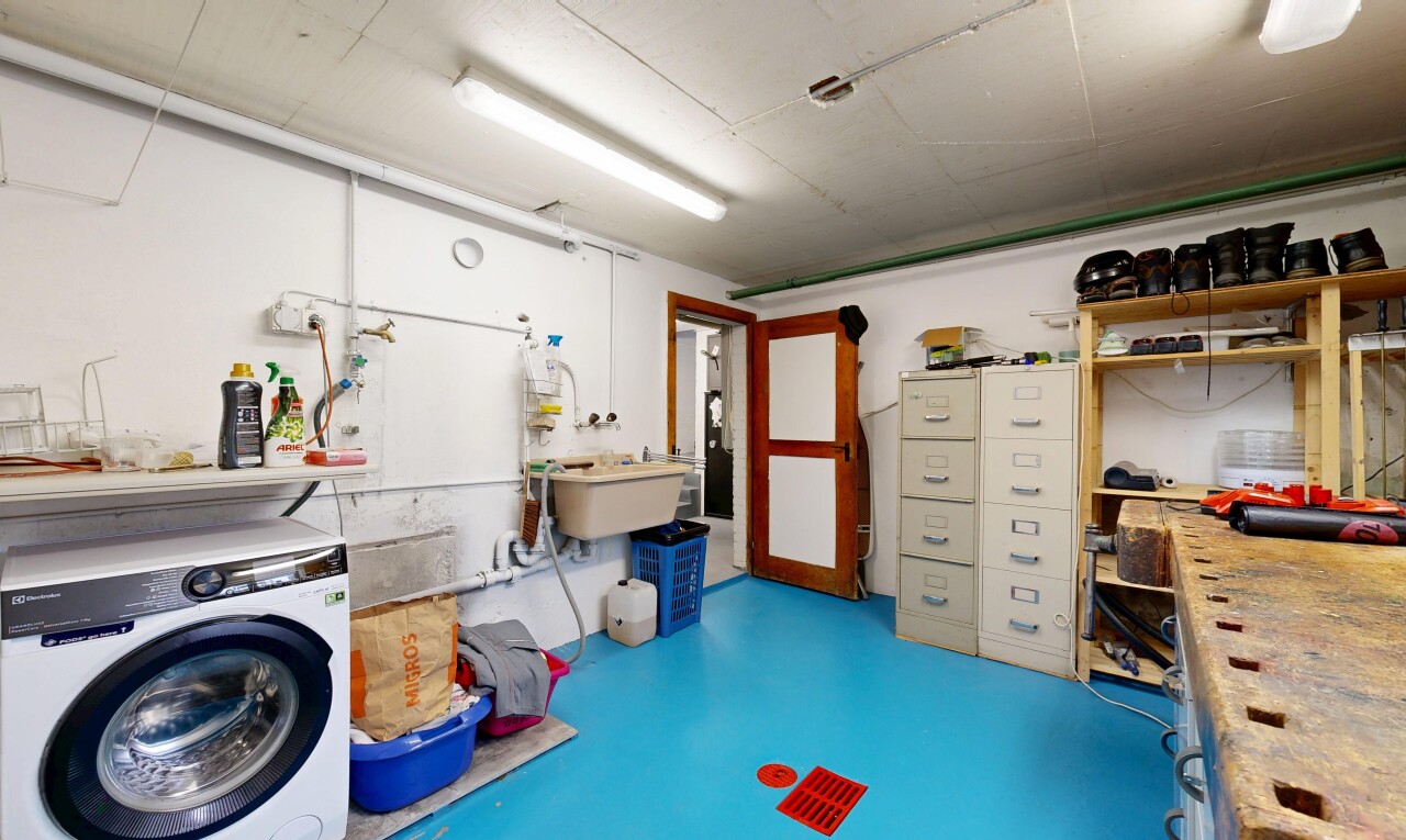 laundry area featuring washer / dryer and concrete flooring
