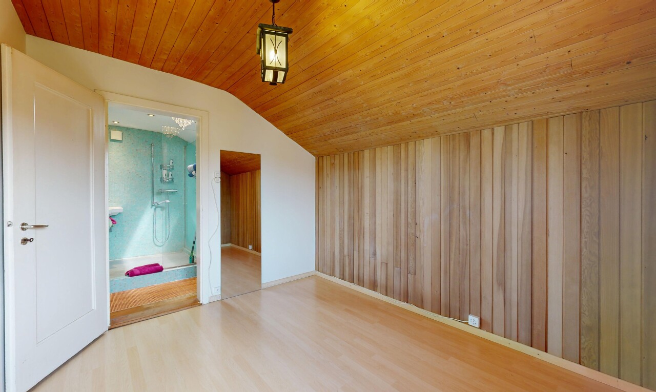 unfurnished room with light wood-type flooring and a vaulted wood ceiling