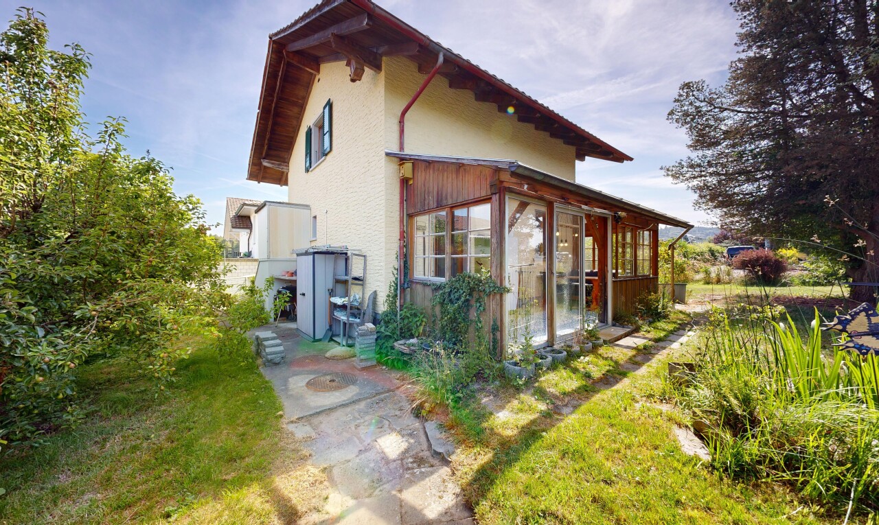 view of home featuring a sunroom