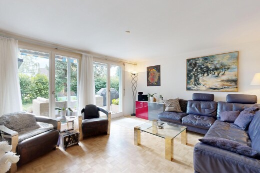 living room featuring parquet floors