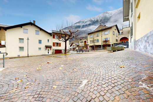 view of home with a mountain view, a residential view, uncovered parking, and stucco siding