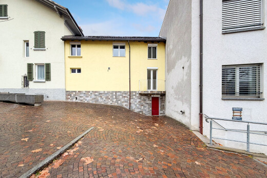 view of home featuring stucco siding and stone siding
