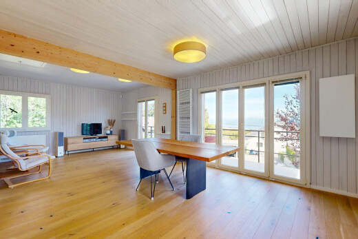 dining area with light wood finished floors and wood walls