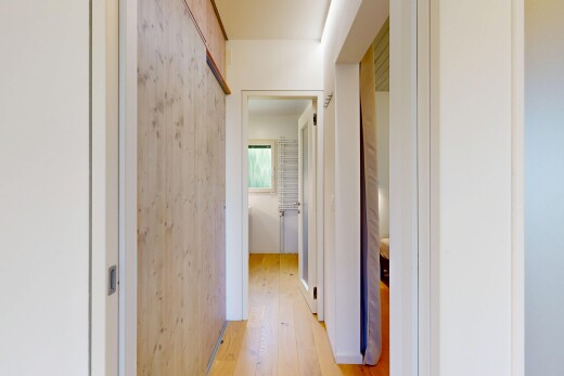hallway with light wood finished floors