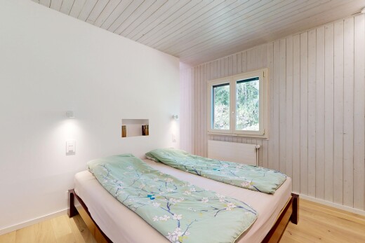 room featuring wooden walls, radiator, wood ceiling, and light wood-style floors