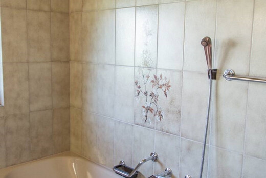 full bath featuring a bath and a shower