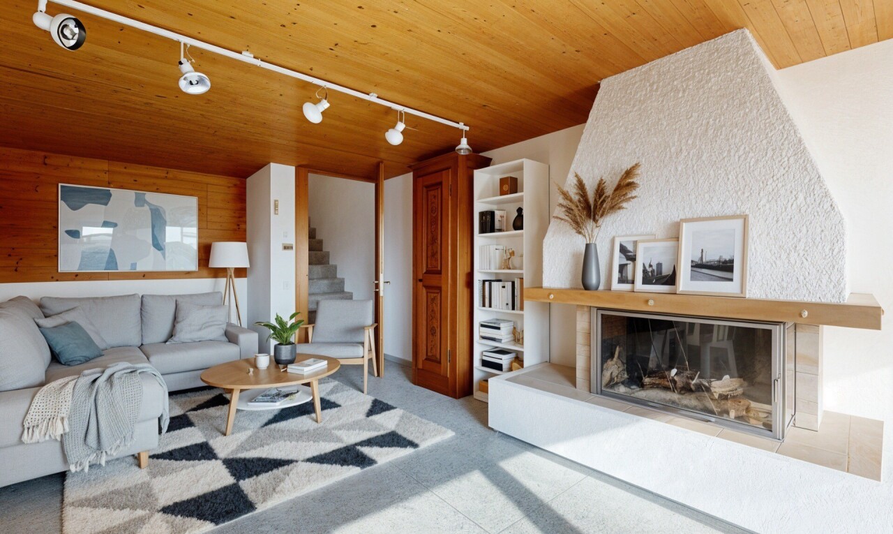salon avec éclairage sur rail, track lighting, cheminée, plafond en bois, et wood ceiling