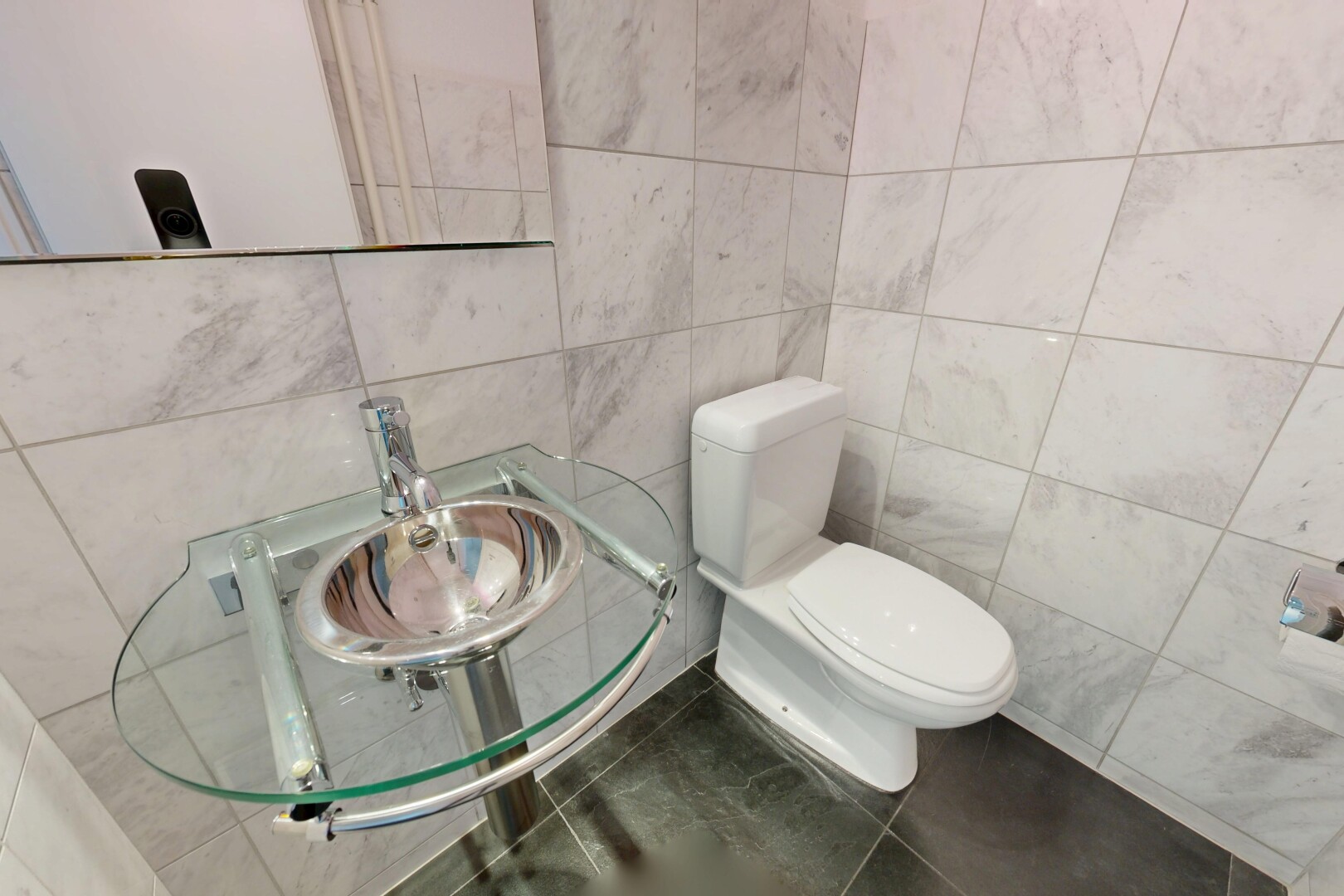 half bath featuring tile walls and tile patterned floors