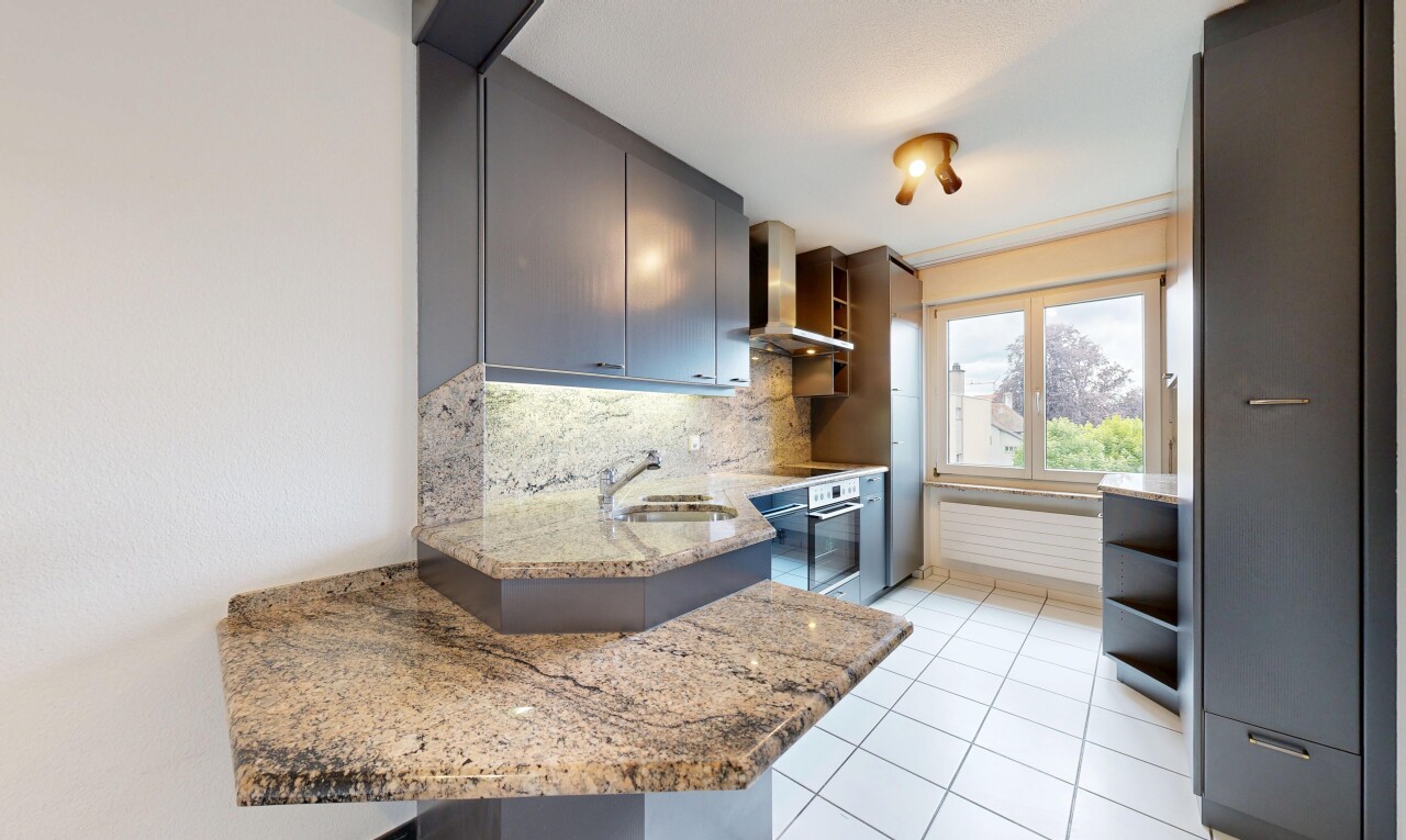 kitchen featuring light stone counters, open shelves, stainless steel oven, tasteful backsplash, and light tile patterned flooring