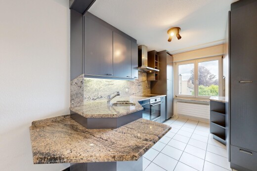 kitchen featuring light stone counters, open shelves, stainless steel oven, tasteful backsplash, and light tile patterned flooring