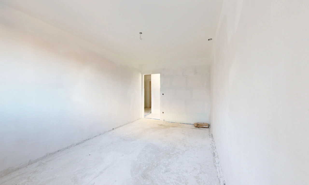 pièce vide avec concrete floor, sol en béton, inside property, drywall, et cloison sèche