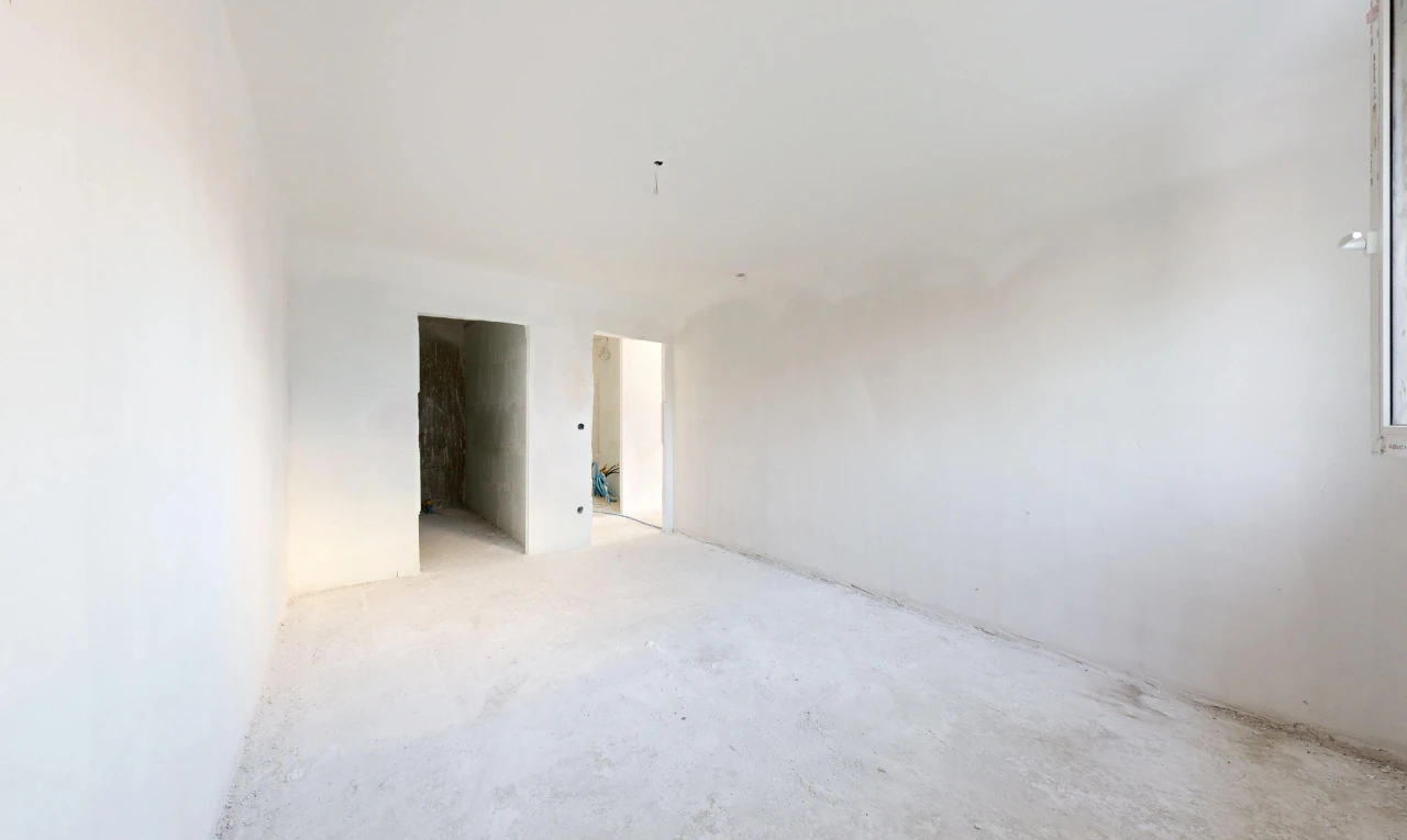 pièce vide avec inside property, sol en béton, concrete floor, cloison sèche, et drywall
