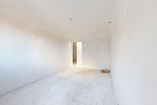 pièce vide avec concrete floor, sol en béton, inside property, drywall, et cloison sèche