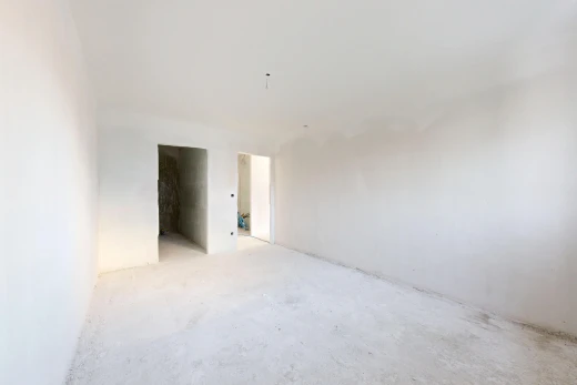 pièce vide avec inside property, sol en béton, concrete floor, cloison sèche, et drywall