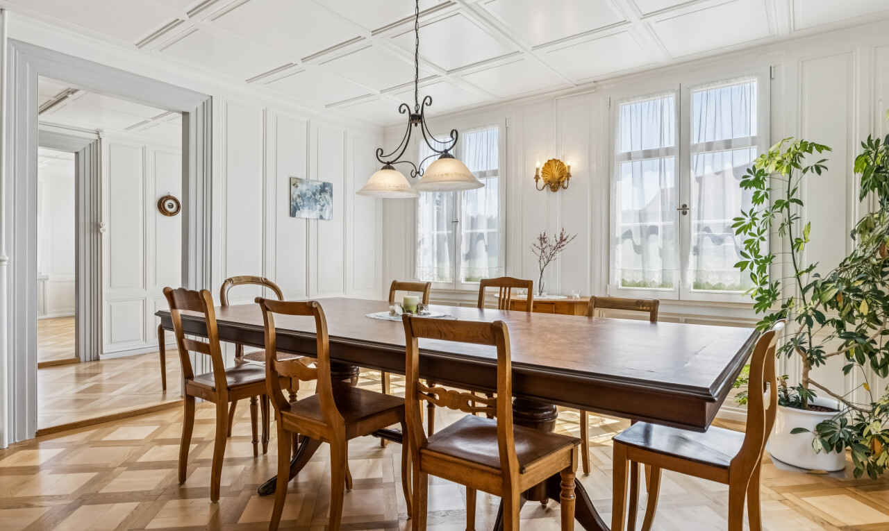 dining area featuring a decorative wall