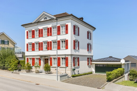 außenansicht mit day time, garage, property visible, und bordsteine