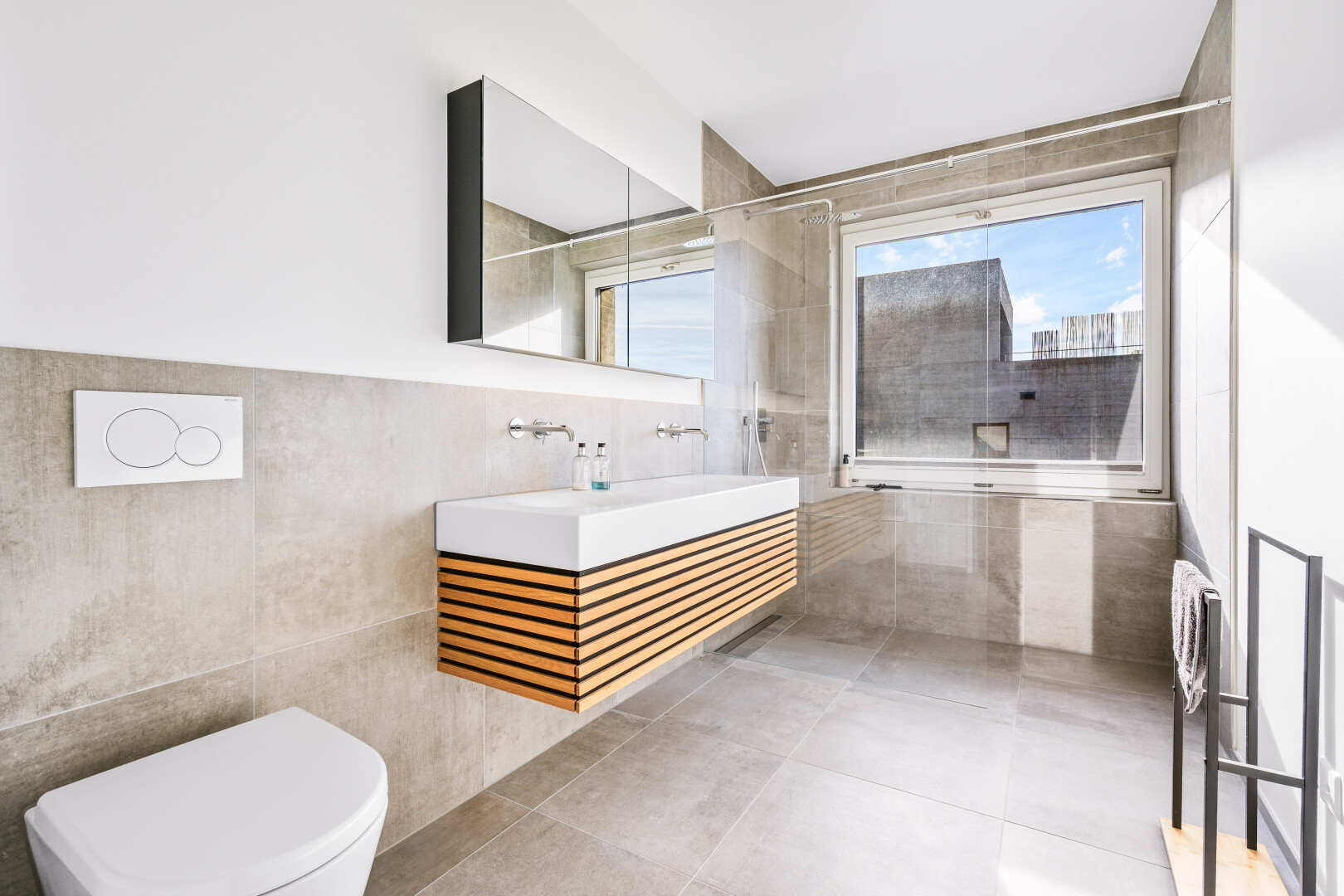 full bathroom with tile walls, a walk in shower, vanity, and tile patterned floors