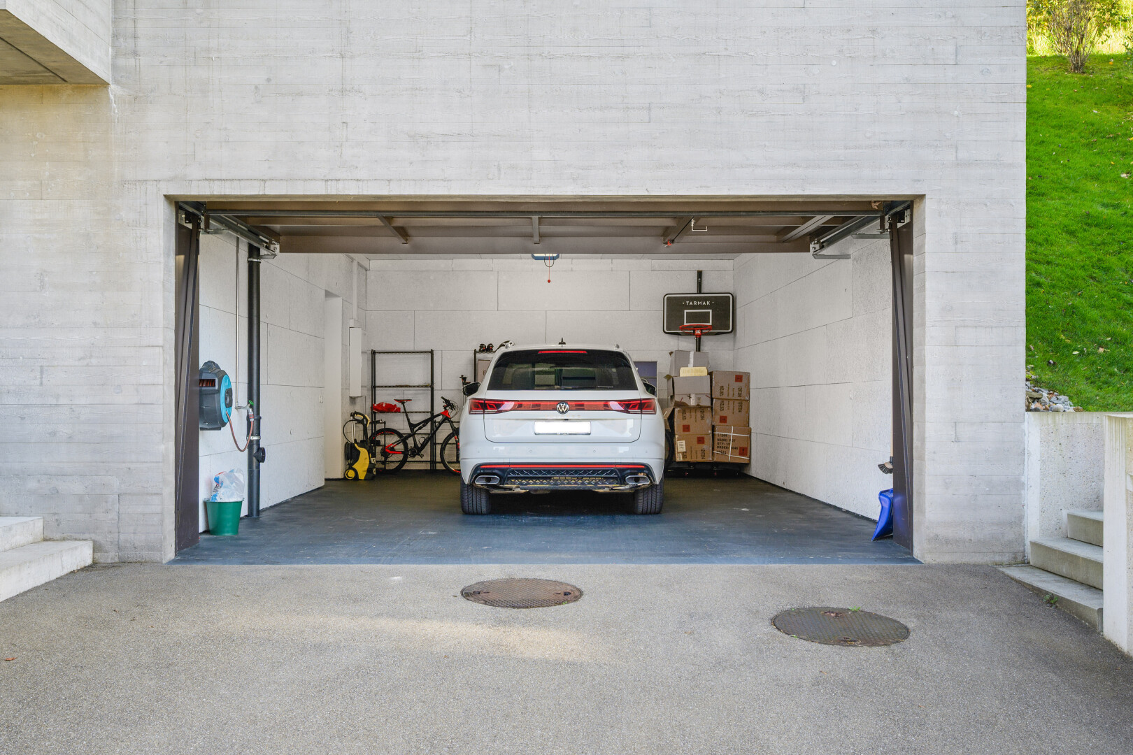 view of vehicle parking featuring a garage