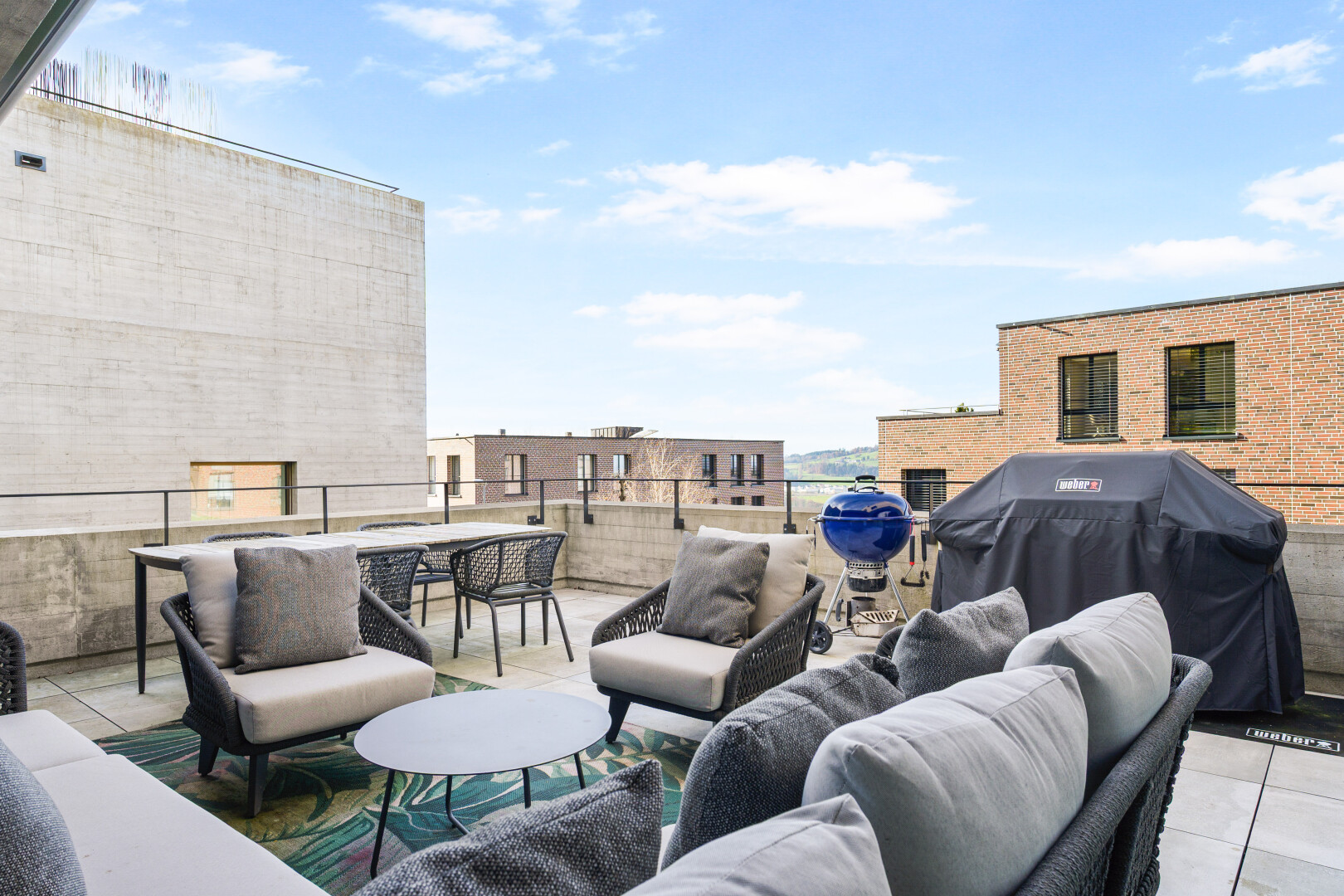 terrace with outdoor lounge area, a patio, and grilling area