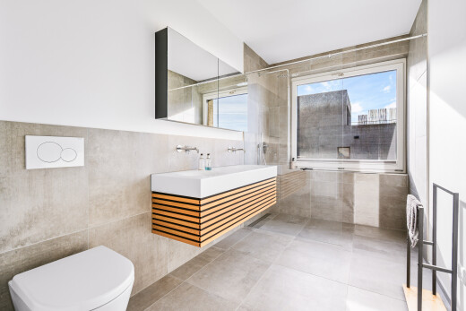 full bathroom with tile walls, a walk in shower, vanity, and tile patterned floors