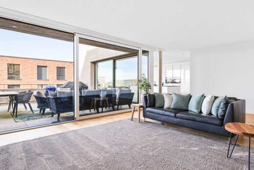 living area featuring wood finished floors and floor to ceiling windows
