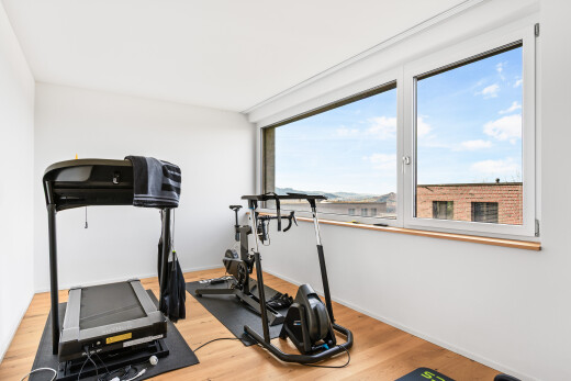 gym featuring light wood-type flooring