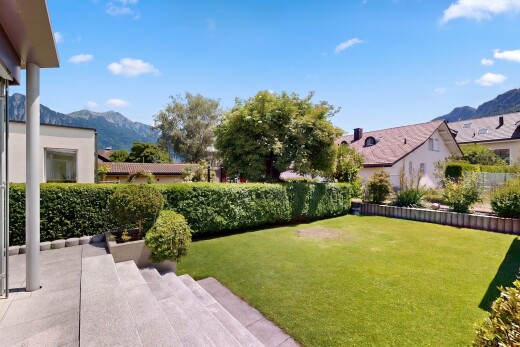 garden featuring a mountain view and a yard