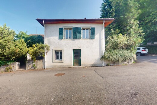 façade avec property visible, bardage en stuc, et day time