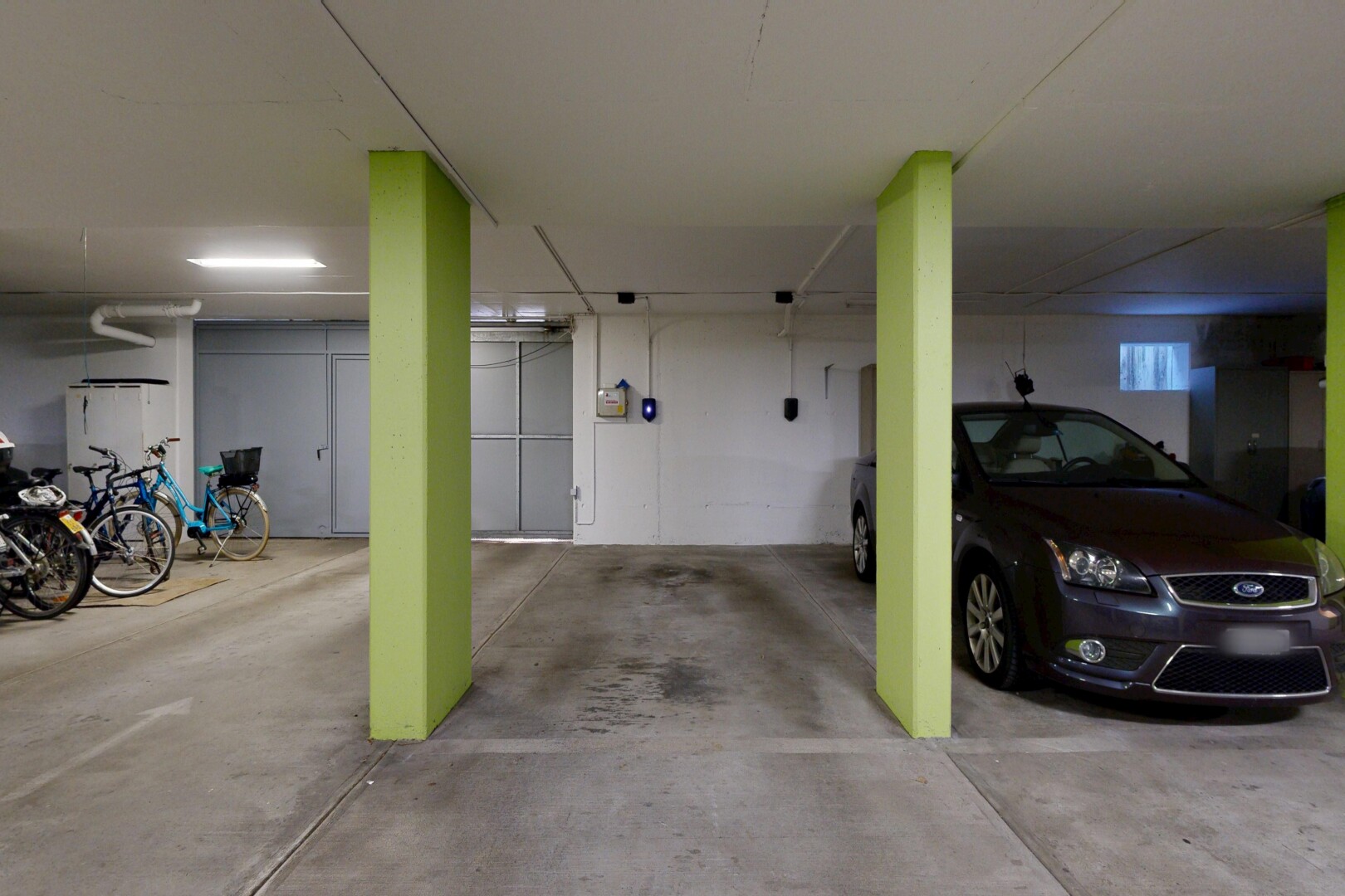 view of parking featuring a parking deck