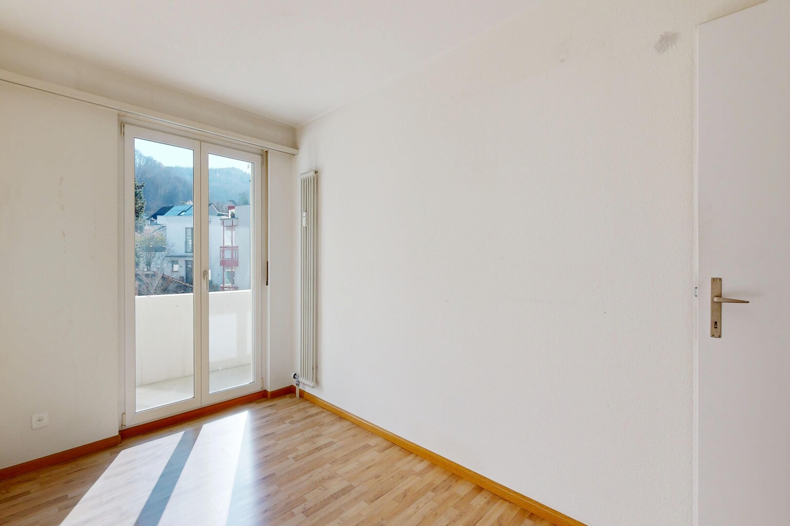 unfurnished room with light wood-style flooring