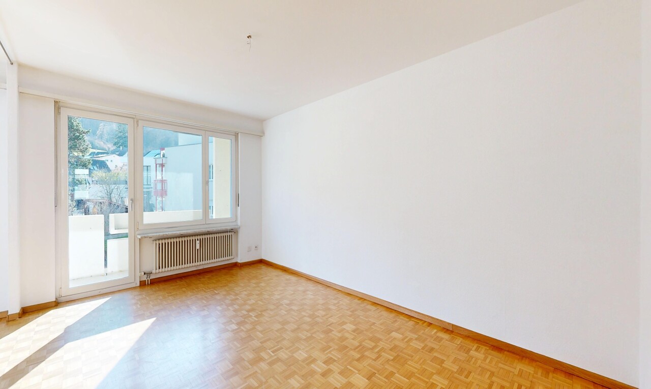 unfurnished room featuring radiator and parquet flooring