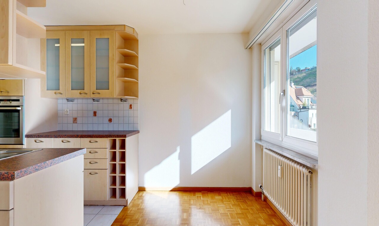 kitchen featuring open shelves, radiator, decorative backsplash, glass fronted cabinets, and parquet flooring