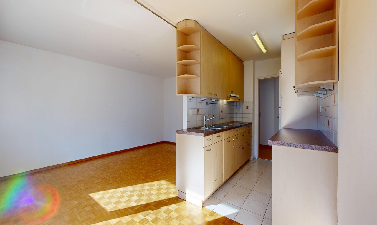 kitchen featuring open shelves, dark countertops, backsplash, and light wood finish cabinets