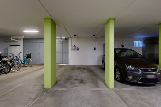 view of parking featuring a parking deck