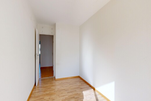 unfurnished room with light wood-style flooring and baseboards