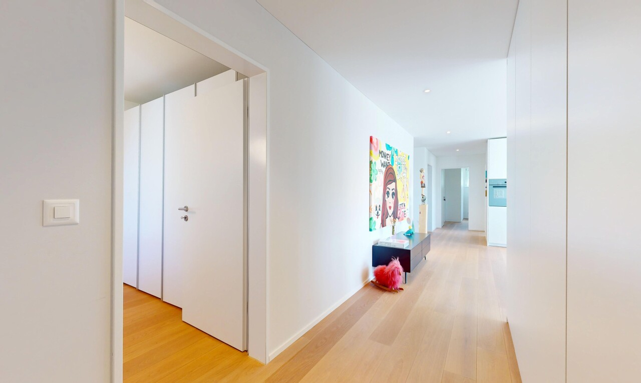 corridor featuring light wood finished floors