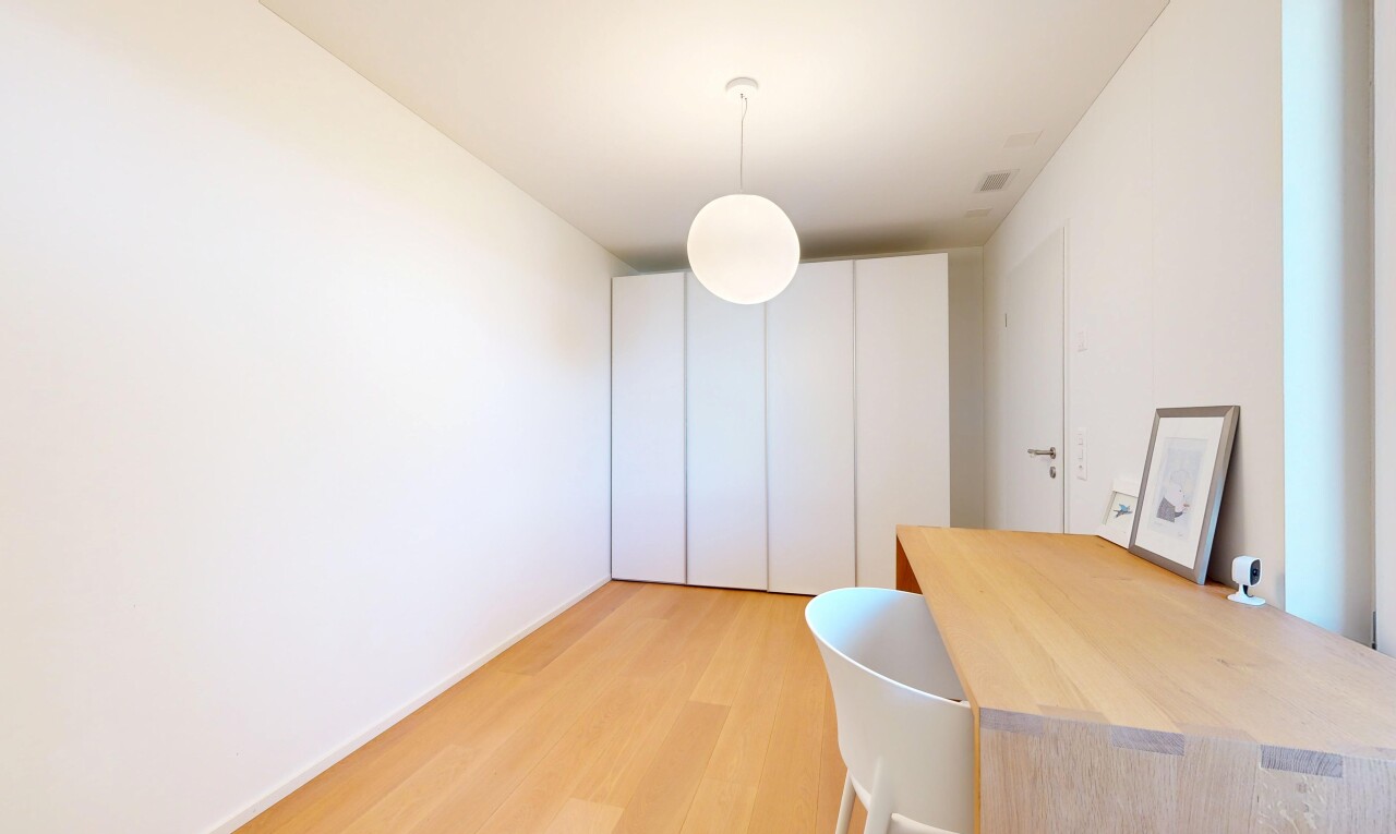 room / bedroom with hanging light fixtures and light wood-style floors