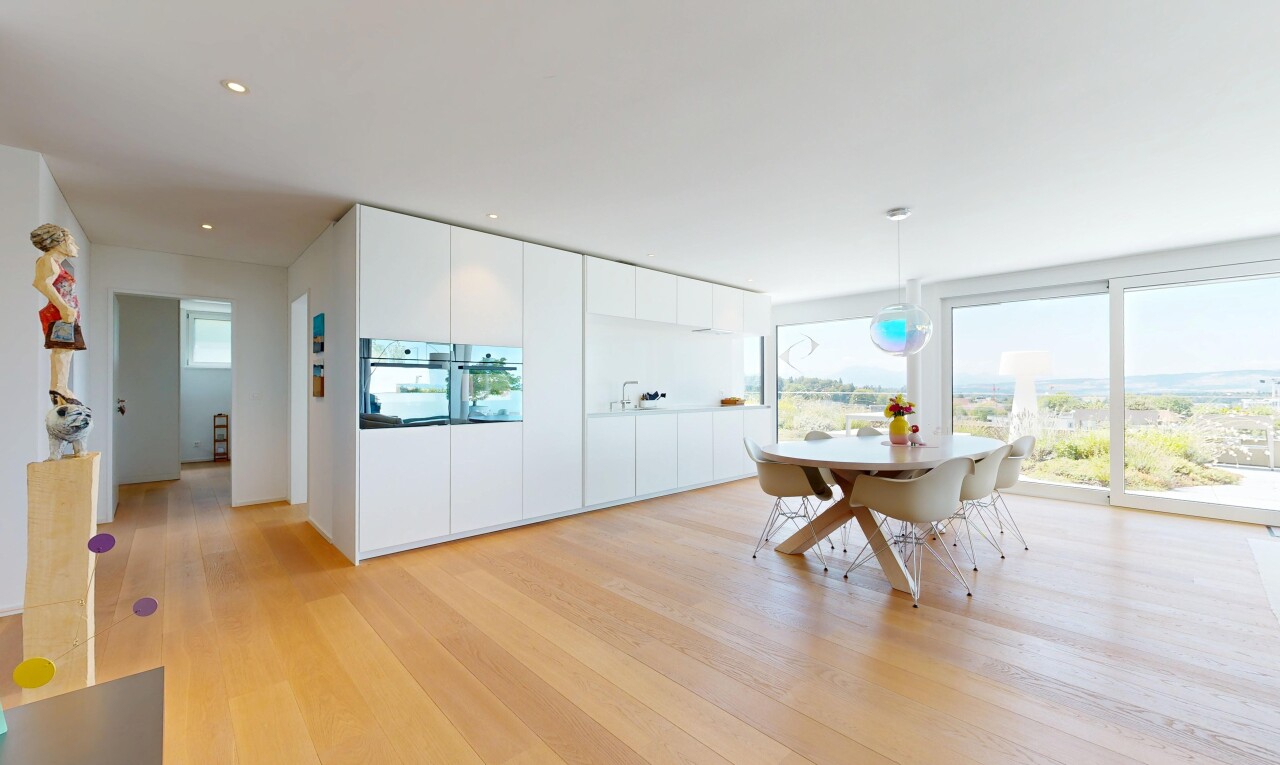 dining room with light wood-type flooring and pendant lighting