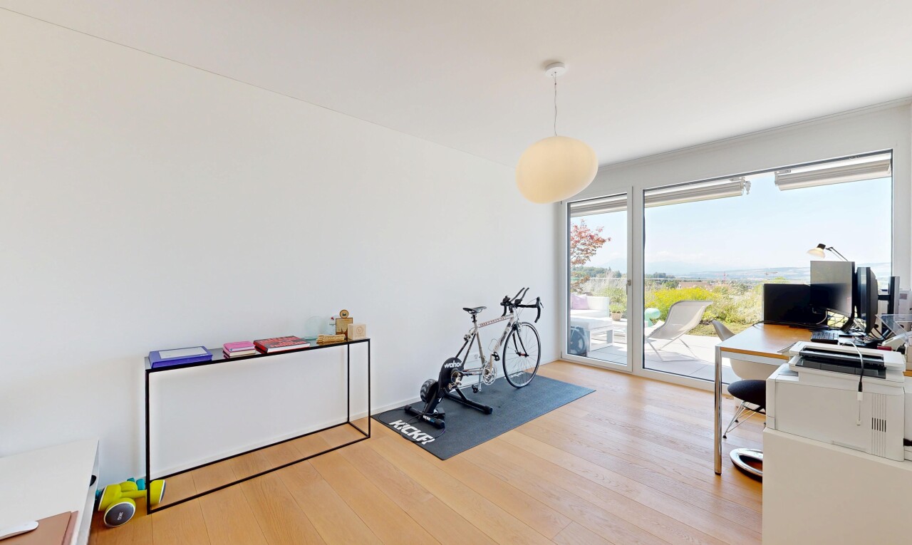 gym featuring light wood finished floors