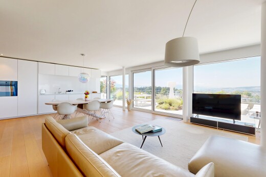 living area featuring pendant lighting and light wood-type flooring