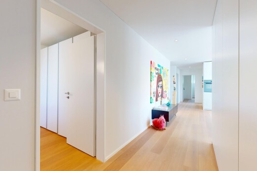 corridor featuring light wood finished floors
