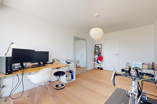 office area featuring decorative light fixtures and light wood-style floors