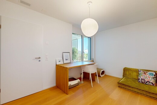 office space featuring decorative light fixtures and light wood-style floors