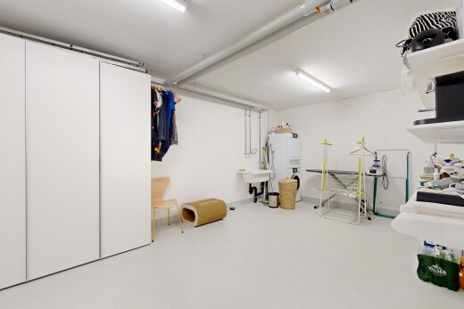 room / bedroom with concrete flooring and a closet
