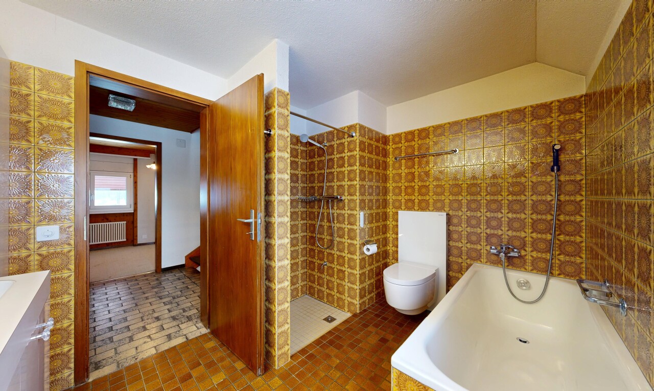 full bath with a bath, a stall shower, radiator heating unit, and vaulted ceiling