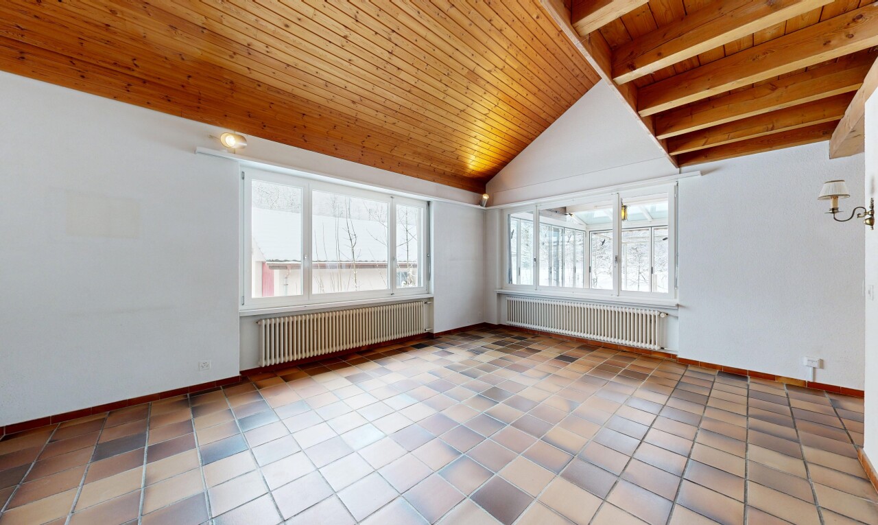 empty room featuring wood ceiling, radiator heating unit, healthy amount of natural light, lofted ceiling, and light tile patterned flooring