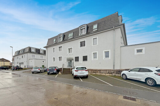 view of property with uncovered parking