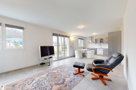 living area featuring baseboards