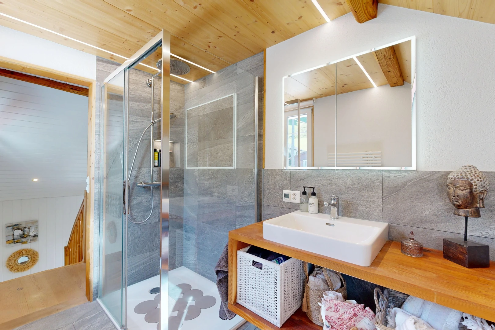 bathroom with a shower stall, wood ceiling, and vanity